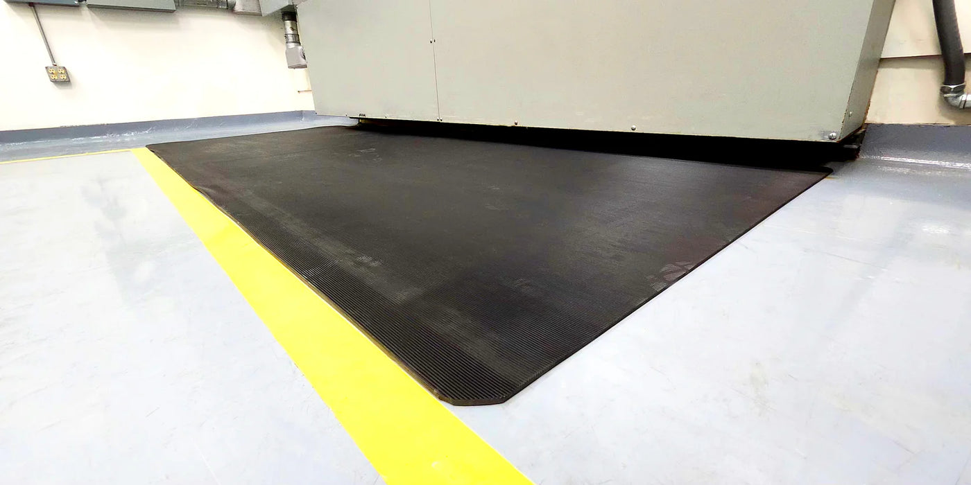 Dielectric switchboard mat under electrical cabinet